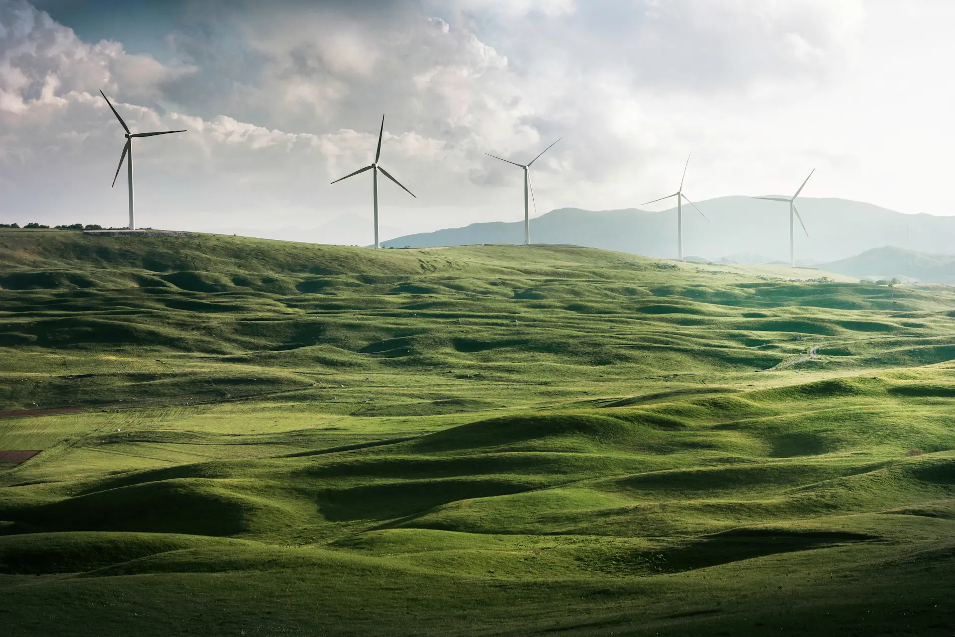Wind turbines on green hills